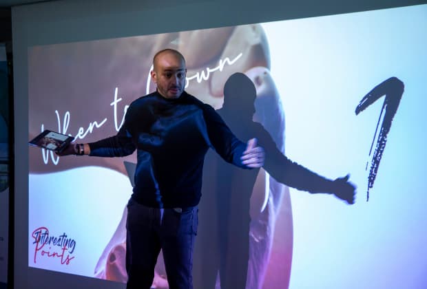 The instructor discusses critical decision points in restorative planning, focusing on when full crown coverage is necessary in adhesive dentistry.